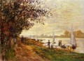 The Riverbank at Le Petit Gennevilliers Sunset Claude Monet scenery
